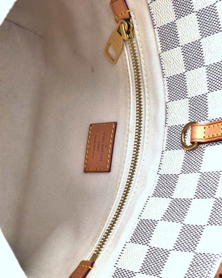 Louis Vuitton Cabas Adventure PM Tote Bag Damier Azur Louis VuittonCabas Adventure PM Tote Bag Damier AzurLouis Vuitton LV Cabas Adventure PM Tote Bag Damier Azur in white with leather strap Articles de voyage paris 101, champs - elysees close up 4k HDForgotten Luxuries Forgotten Luxuries