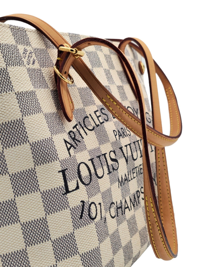 Louis Vuitton Cabas Adventure PM Tote Bag Damier Azur Louis VuittonCabas Adventure PM Tote Bag Damier AzurLouis Vuitton LV Cabas Adventure PM Tote Bag Damier Azur in white with leather strap Articles de voyage paris 101, champs - elysees close up 4k HDForgotten Luxuries Forgotten Luxuries