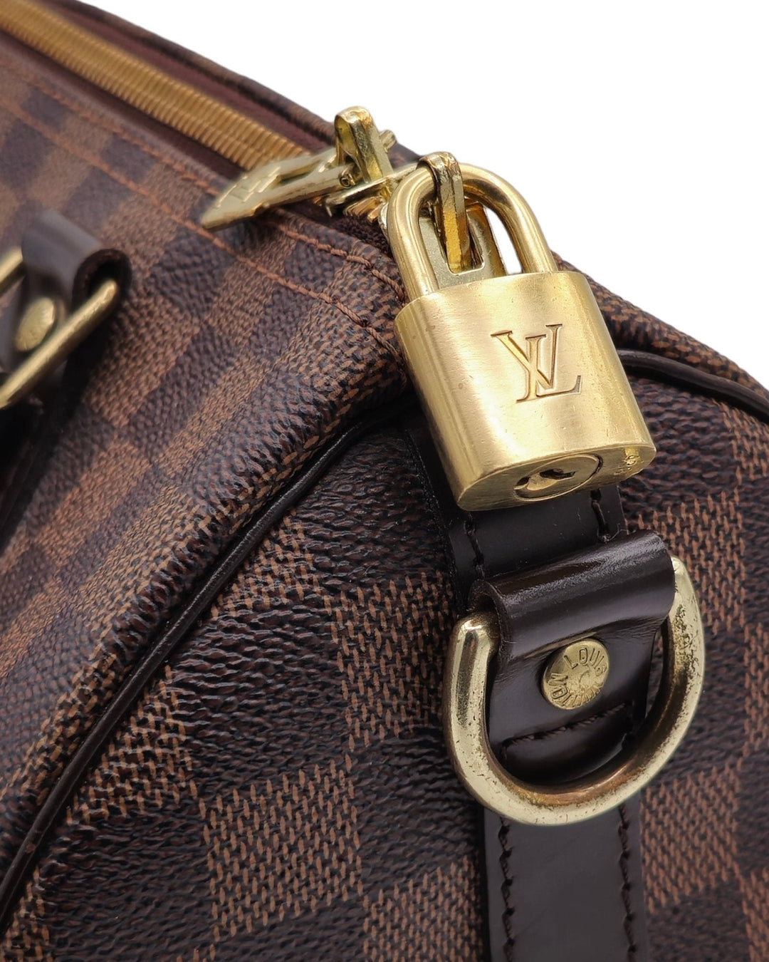 Louis Vuitton Damier Ebene Speedy Bandouliere 25 Louis VuittonDamier Ebene Speedy Bandouliere 25Louis Vuitton LV Damier Ebene Speedy Bandouliere 25 bag brown canvas leather with gold hardware side profileForgotten Luxuries Forgotten Luxuries