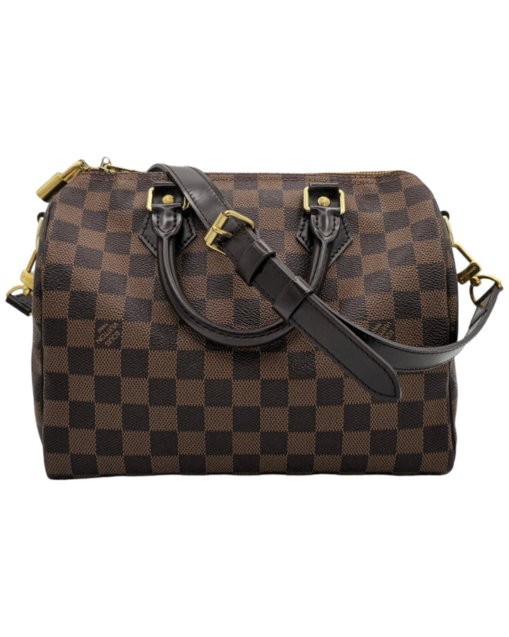 Louis Vuitton Damier Ebene Speedy Bandouliere 25 Louis VuittonDamier Ebene Speedy Bandouliere 25Louis Vuitton LV Damier Ebene Speedy Bandouliere 25 bag brown canvas leather with gold hardware side profileForgotten Luxuries Forgotten Luxuries