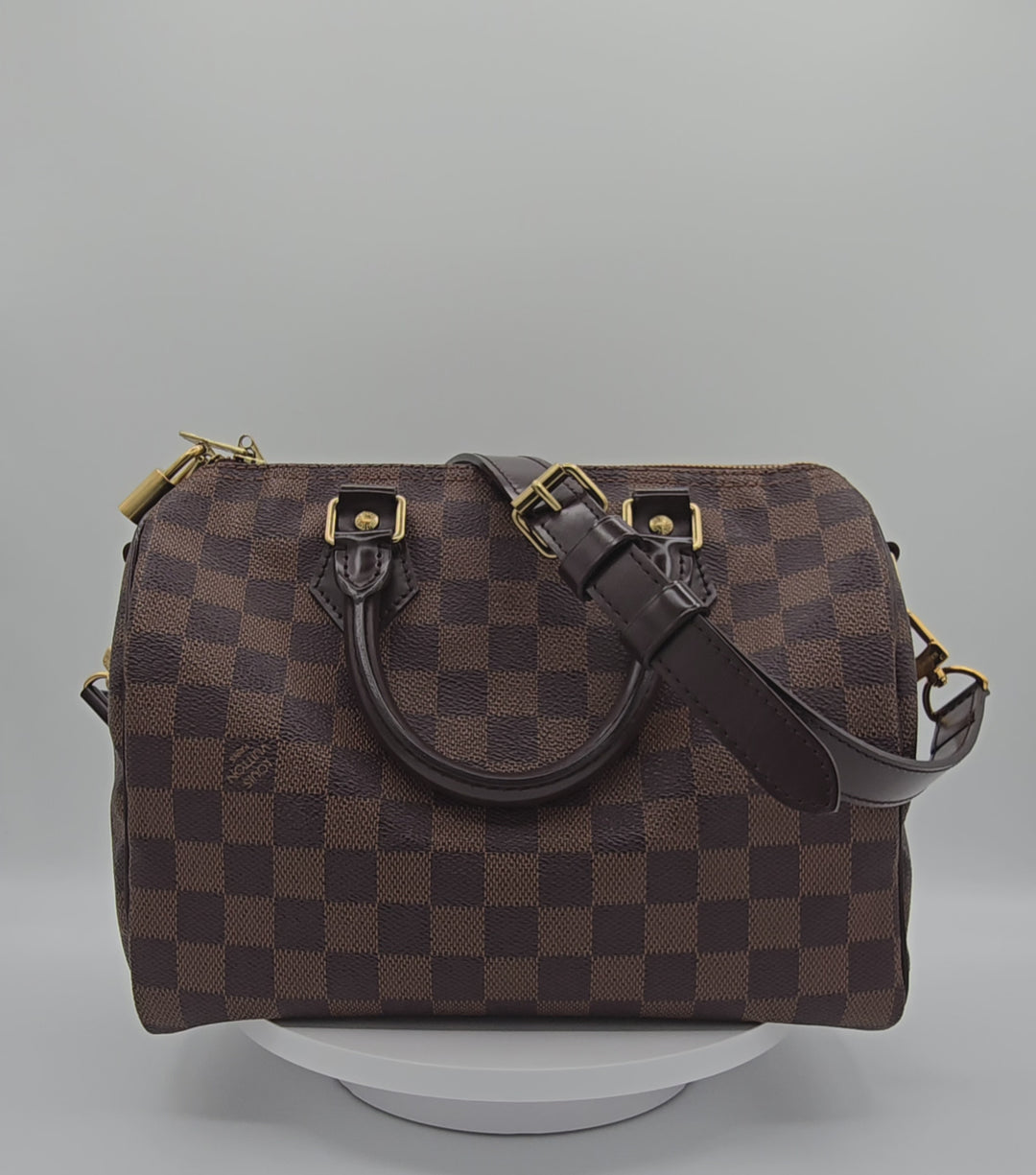 Louis Vuitton LV Damier Ebene Speedy Bandouliere 25 bag brown canvas leather with gold hardware 360 spin slow motion video 4k hd forgotten luxuries